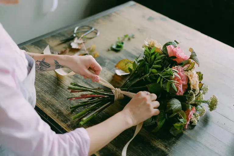 Woman getting a bouquet ready